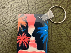 Two Faces with Ocean and Palm Tree Key Ring